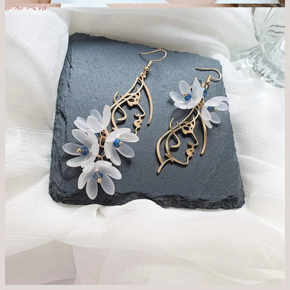 Woman Face Earrings with Gentle Flowers